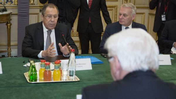 French Foreign Minister Jean-Marc Ayrault (Rear), Russian Foreign Minister Sergei Lavrov (Rear L) and German Foreign Minister Frank-Walter Steinmeier (Front) are pictured before a joint meeting on the situation in Ukraine with their Ukrainian counterpart at the French Foreign Ministry in Paris on March 3, 2016 - Sputnik International