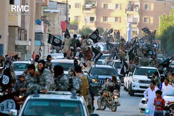 In this undated file image posted on Monday, June 30, 2014, by the Raqqa Media Center of the Islamic State group, a Syrian opposition group, which has been verified and is consistent with other AP reporting, fighters from the Islamic State group parade in Raqqa, north Syria In this undated file image posted on Monday, June 30, 2014, by the Raqqa Media Center of the Islamic State group, a Syrian opposition group, which has been verified and is consistent with other AP reporting, fighters from the Islamic State group parade in Raqqa, north Syria - Sputnik International