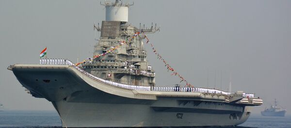 Indian Navy personnel stand on the INS Vikramaditya, a modified Kiev-class aircraft carrier, during the International Fleet Review in Visakhapatnam on February 6, 2016 - Sputnik International