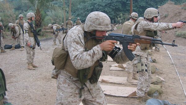 US Marine Lance Corporal Cheema firing the East German MpiKMS-72 variant of the updated version of the AK-47 assault rifle. File photo - Sputnik International