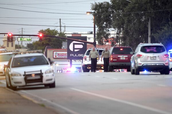 Police cars surround the Pulse Orlando nightclub, the scene of a fatal shooting, in Orlando, Fla., Sunday, June 12, 2016 - Sputnik International