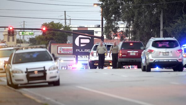 Police cars surround the Pulse Orlando nightclub, the scene of a fatal shooting, in Orlando, Fla., Sunday, June 12, 2016 - Sputnik International