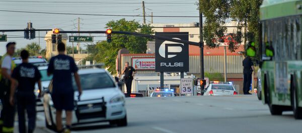 Police lock down Orange Avenue around Pulse nightclub, where people were killed by a gunman in a shooting rampage in Orlando, Florida June 12, 2016 Police lock down Orange Avenue around Pulse nightclub, where people were killed by a gunman in a shooting rampage in Orlando, Florida June 12, 2016 - Sputnik International