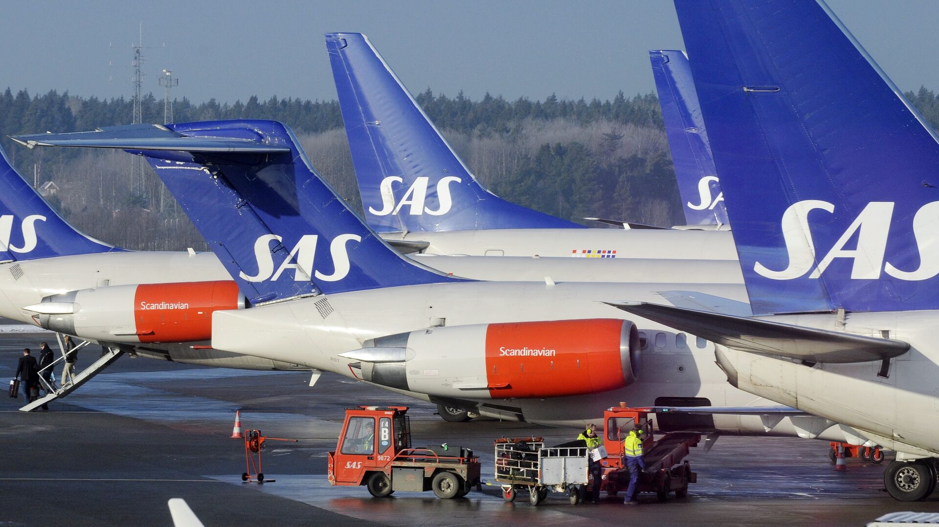 SAS aircraft are seen parked at the gates at terminal 4 of Arlanda Airport near Stockholm - Sputnik International, 1920, 22.02.2022