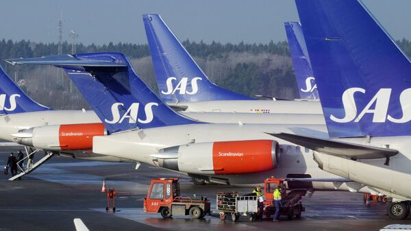 SAS aircraft are seen parked at the gates at terminal 4 of Arlanda Airport near Stockholm - Sputnik International