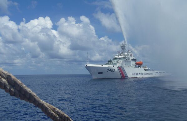 Chinese Coast Guard members off Scarborough Shoal in the South China Sea. file photo Chinese Coast Guard members off Scarborough Shoal in the South China Sea. file photo - Sputnik International