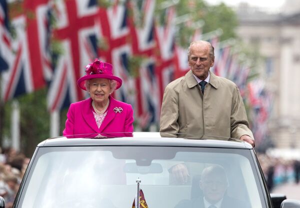 Britain's Queen Elizabeth II and Britain's Prince Philip, Duke of Edinburgh are driven along the Mall during the Patron's Lunch. Britain's Queen Elizabeth II and Britain's Prince Philip, Duke of Edinburgh are driven along the Mall during the Patron's Lunch. - Sputnik International