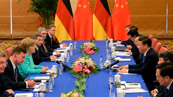 German Chancellor Angela Merkel (3rd L) attends a meeting with Chinese President Xi Jinping (3rd R) at Beijing Hotel, in Beijing, China, June 13, 2016. - Sputnik International
