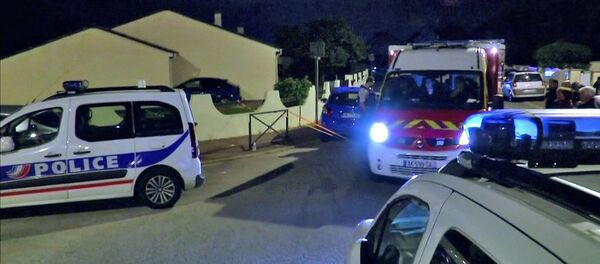 Still image taken from video shows Police vehicles at the scene near where a French police commander was stabbed to death in front of his home in the Paris suburb of Magnanville, France, June 14, 2016. - Sputnik International
