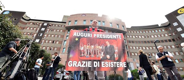 A man holds a banner reading All the best president, thanks for existing in front of San Raffaele hospital, as Italian surgeons begin a four-hour heart operation on former prime minister Silvio Berlusconi on Tuesday to replace a defective aortic valve, a hospital statement said, in Milan, Italy June 14, 2016. A man holds a banner reading All the best president, thanks for existing in front of San Raffaele hospital, as Italian surgeons begin a four-hour heart operation on former prime minister Silvio Berlusconi on Tuesday to replace a defective aortic valve, a hospital statement said, in Milan, Italy June 14, 2016. - Sputnik International