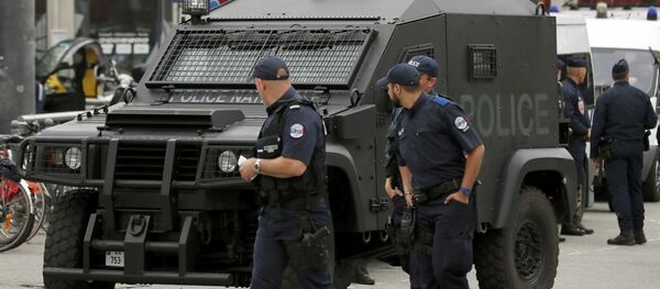 A police patrol looks at an armoured police vehicle parked in front of the train station in Lille, France. A police patrol looks at an armoured police vehicle parked in front of the train station in Lille, France. - Sputnik International