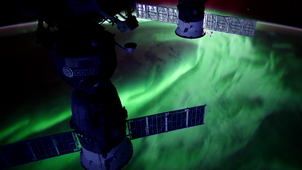 This still shows a stunning aurora captured from the International Space Station. - Sputnik International