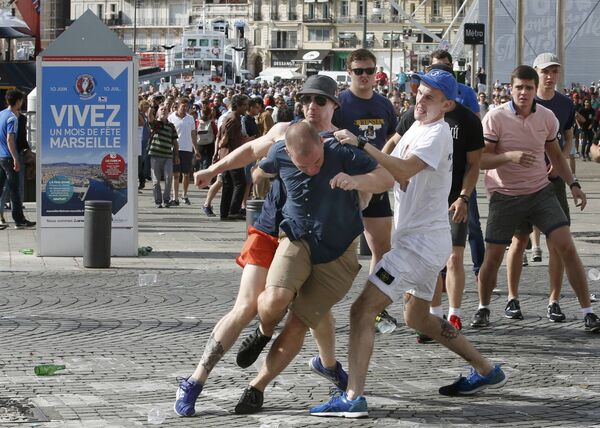 Football Soccer - Euro 2016 - England v Russia - Group B - Marseille, France - 11/6/16 Rival supporters clash at the old port of Marseille before the game. Football Soccer - Euro 2016 - England v Russia - Group B - Marseille, France - 11/6/16 Rival supporters clash at the old port of Marseille before the game. - Sputnik International