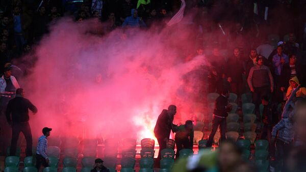 Flares are thrown in the stadium during clashes that erupted after a football match between Egypt's Al-Ahly and Al-Masry teams in Port Said, 220 kms northeast of Cairo. (File) - Sputnik International