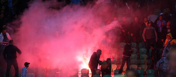 Flares are thrown in the stadium during clashes that erupted after a football match between Egypt's Al-Ahly and Al-Masry teams in Port Said, 220 kms northeast of Cairo. (File) - Sputnik International