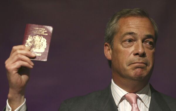 Leader of the United Kingdom Independence Party (UKIP) Nigel Farage holds his passport as he speaks at pro Brexit event in London, Britain June 3, 2016. - Sputnik International