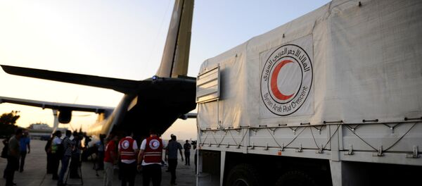 Humanitarian aid supplies are unloaded from a Czech military airplane into a Syrian Arab Red Crescent truck, after it landed in Damascus airport, Syria June 5, 2016 Humanitarian aid supplies are unloaded from a Czech military airplane into a Syrian Arab Red Crescent truck, after it landed in Damascus airport, Syria June 5, 2016 - Sputnik International