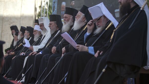 In this Saturday, June 18, 2016 photo released by Holy and Great Council, Orthodox Patriarchs taking part in the historic Holy and Great Council sit outside the church of St. Titus before celebrating Vespers of Pentecost in Heraklion, on the island of Crete - Sputnik International