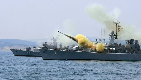An anti-submarine rocket blasts off a rocket launcher from the Bulgarian navy frigate Drazki during the BREEZE 2014 military drill in the Black Sea on July 11, 2014 - Sputnik International