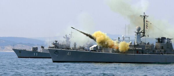 An anti-submarine rocket blasts off a rocket launcher from the Bulgarian navy frigate Drazki during the BREEZE 2014 military drill in the Black Sea on July 11, 2014 - Sputnik International