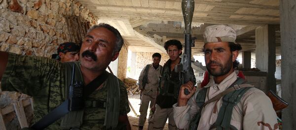 Fighters of the Syria Democratic Forces (SDF) stand inside a building near Manbij, in Aleppo Governorate, Syria, June 17, 2016 Fighters of the Syria Democratic Forces (SDF) stand inside a building near Manbij, in Aleppo Governorate, Syria, June 17, 2016 - Sputnik International