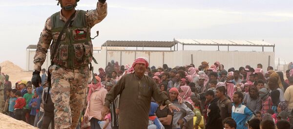 A Jordanian soldier stands guard as Syrian refugees (file) A Jordanian soldier stands guard as Syrian refugees (file) - Sputnik International