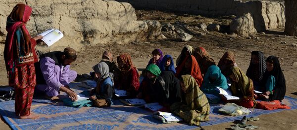 Afghan schoolchildren study at an open-air classroom in the Panjwai district of Kandahar province Afghan schoolchildren study at an open-air classroom in the Panjwai district of Kandahar province - Sputnik International