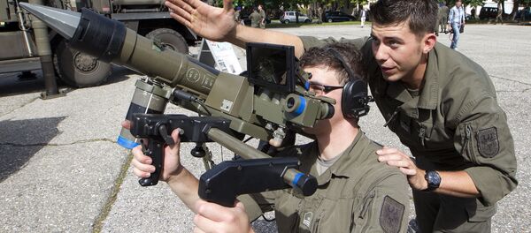 Two soldiers of the Austrian Army antiaircraft defense regiment pose with a Mistral antiaircraft guided missile Two soldiers of the Austrian Army antiaircraft defense regiment pose with a Mistral antiaircraft guided missile - Sputnik International