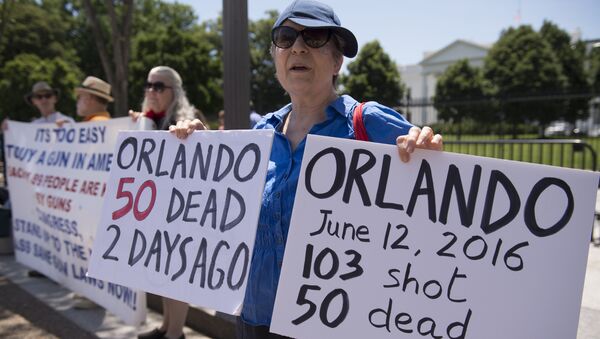 This file photo taken on June 13, 2016 shows people gather to protest gun violence and call for sensible gun laws outside the White House in Washington, D - Sputnik International