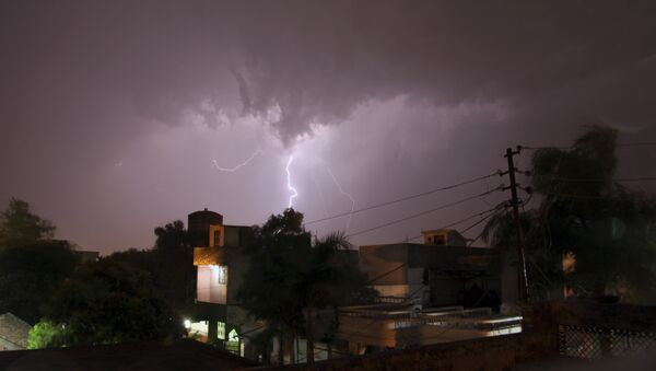 In this Sunday, May 17, 2015 photo, bolt of lightning illuminates the night sky in Jammu, India. - Sputnik International