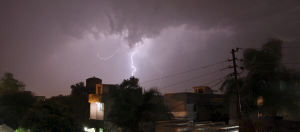 In this Sunday, May 17, 2015 photo, bolt of lightning illuminates the night sky in Jammu, India. In this Sunday, May 17, 2015 photo, bolt of lightning illuminates the night sky in Jammu, India. - Sputnik International