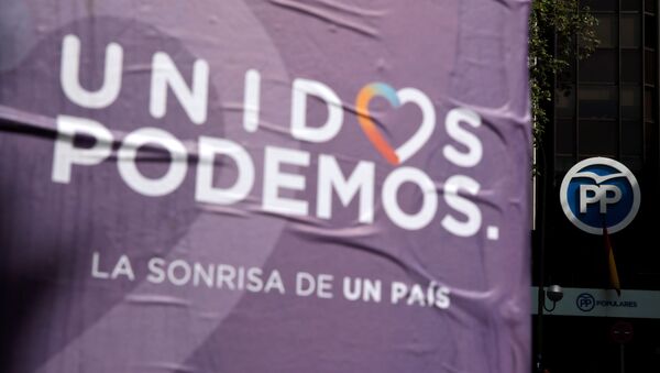 Posters of the coalition of Unidos Podemos (United We Can) hang near the People's Party (PP) headquarters in Madrid, Spain - Sputnik International