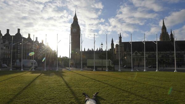A man lies on the ground in Parliament Square in London, Britain June 24, 2016. - Sputnik International
