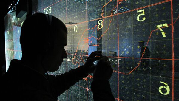 An operator by the map-board at the training command center during large-scale exercises of the Air Force and Air Defense troops - Sputnik International