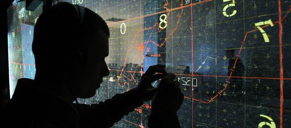 An operator by the map-board at the training command center during large-scale exercises of the Air Force and Air Defense troops An operator by the map-board at the training command center during large-scale exercises of the Air Force and Air Defense troops - Sputnik International