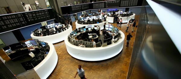 Traders work at their desks in front of the German share price index, DAX board, at the stock exchange in Frankfurt, Germany, June 24, 2016 after Britain voted to leave the European Union in the EU BREXIT referendum. Traders work at their desks in front of the German share price index, DAX board, at the stock exchange in Frankfurt, Germany, June 24, 2016 after Britain voted to leave the European Union in the EU BREXIT referendum. - Sputnik International