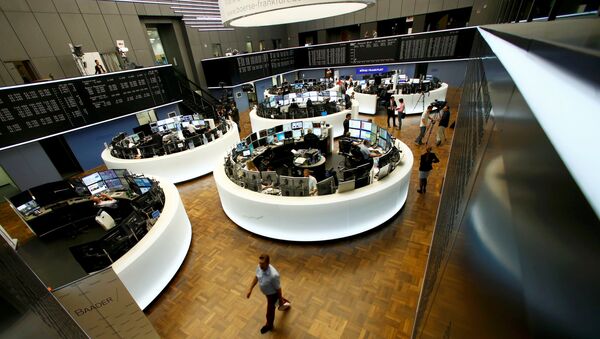 Traders work at their desks in front of the German share price index, DAX board, at the stock exchange in Frankfurt, Germany, June 24, 2016 after Britain voted to leave the European Union in the EU BREXIT referendum. - Sputnik International