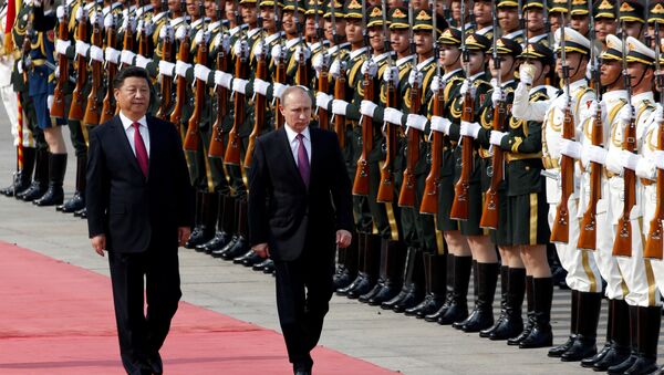 Russian President Vladimir Putin (R) and his Chinese counterpart Xi Jinping attend a welcoming ceremony outside the Great Hall of the People in Beijing, China, June 25, 2016 - Sputnik International