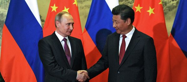Russian President Vladimir Putin (R) and his Chinese counterpart Xi Jinping attend a welcoming ceremony outside the Great Hall of the People in Beijing, China, June 25, 2016 Russian President Vladimir Putin (R) and his Chinese counterpart Xi Jinping attend a welcoming ceremony outside the Great Hall of the People in Beijing, China, June 25, 2016 - Sputnik International