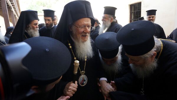 Orthodox priests pay their respects to Ecumenical Patriarch Bartholomew I, before the summit of the Holy and Great Council, the gathering of spiritual leaders of the world's Orthodox Christians, in the Gonia Monastery, near the town of Chania, on island of Crete, Greece, June 20, 2016 - Sputnik International