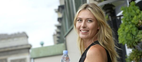 Russina tennis player and international ambassador for French mineral water company Evian, Maria Sharapova poses during a photocall prior to the start of the sporting season for the Evian brand (Tennis and Golf) in Paris on May 18, 2015 Russina tennis player and international ambassador for French mineral water company Evian, Maria Sharapova poses during a photocall prior to the start of the sporting season for the Evian brand (Tennis and Golf) in Paris on May 18, 2015 - Sputnik International