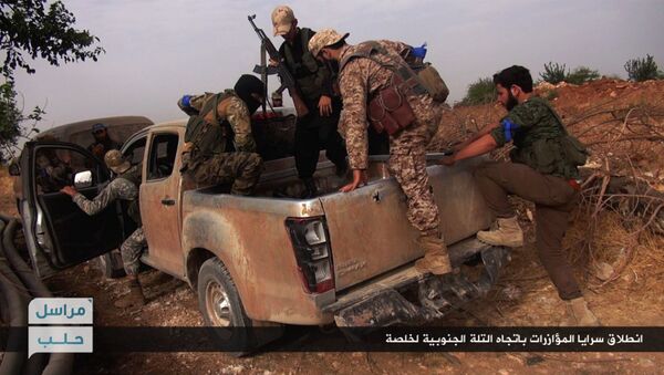 This image posted on the Twitter page of Syria's al-Qaida-linked Nusra Front on Wednesday, June 15, 2016, which is consistent with AP reporting, shows Nusra Front fighters on their vehicle preparing to leave and battle against Syrian troops and pro-government gunmen, at the hilltop of Khalsa village, southern Aleppo, Syria - Sputnik International