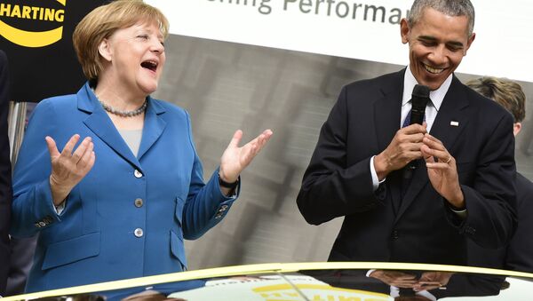 US President Barack Obama (R) and German Chancellor Angela Merkel share a laugh at the booth of Harting technology group as they tour the Hanover industrial Fair in Hanover, central Germany, on April 25, 2016 - Sputnik International