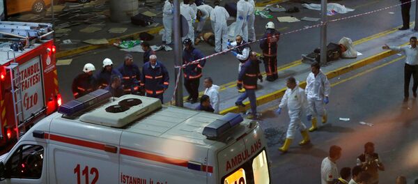 Forensic experts work outside Turkey's largest airport, Istanbul Ataturk, Turkey, following a blast, June 28, 2016. - Sputnik International