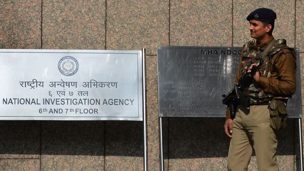 A Central Industrial Security Force guard stands outside the office of the National Investigation Agency (NIA) in New Delhi - Sputnik International