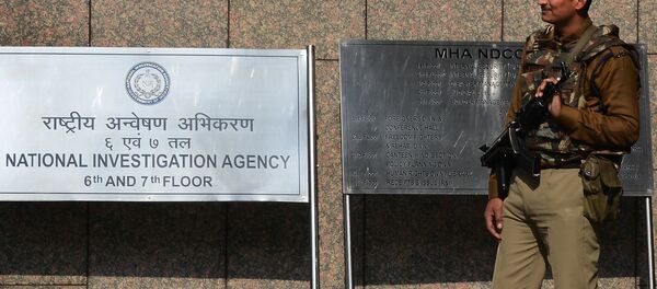 A Central Industrial Security Force guard stands outside the office of the National Investigation Agency (NIA) in New Delhi - Sputnik International