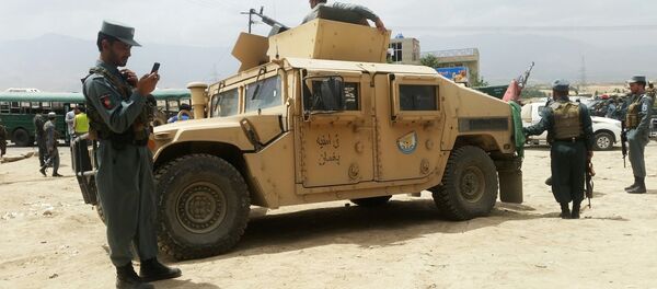 Afghan security forces keep watch at the site of a suicide attack on the western outskirts of Kabul, Afghanistan June 30, 2016. - Sputnik International