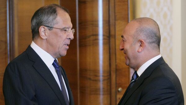 Russian Foreign Minister Sergei Lavrov (L) shakes hands with President of the Council of Europe's Parliamentary Assembly Mevlut Cavusoglu. (File) - Sputnik International