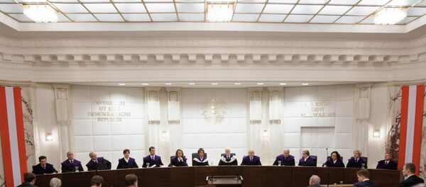 View on the podium with the President of the Constitutional Court of Austria Gerhart Holzinger (C-R) and vice president Brigitte Bierlein (C-L) prior to the first public hearing to deal with the action of annulment of the result of Austrian Presidential election run-off, on June 20, 2016 in Vienna. (File) View on the podium with the President of the Constitutional Court of Austria Gerhart Holzinger (C-R) and vice president Brigitte Bierlein (C-L) prior to the first public hearing to deal with the action of annulment of the result of Austrian Presidential election run-off, on June 20, 2016 in Vienna. (File) - Sputnik International