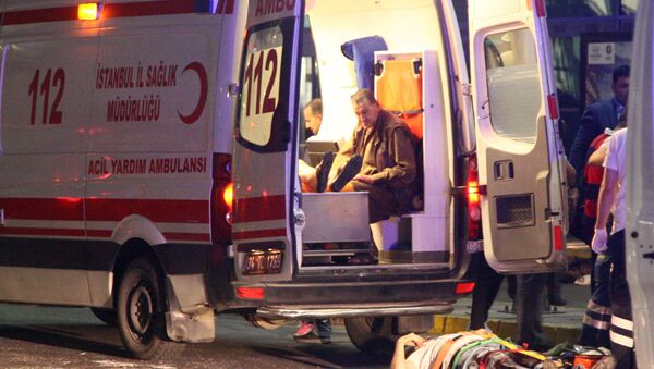 Paramedics attend to casualties outside Turkey's largest airport, Istanbul Ataturk, Turkey, following an attack, June 28, 2016 - Sputnik International